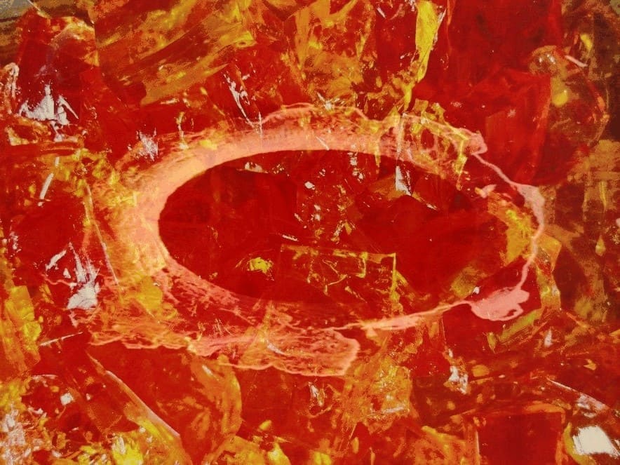 red-orange jello with an oblong hole, suggesting an entry point